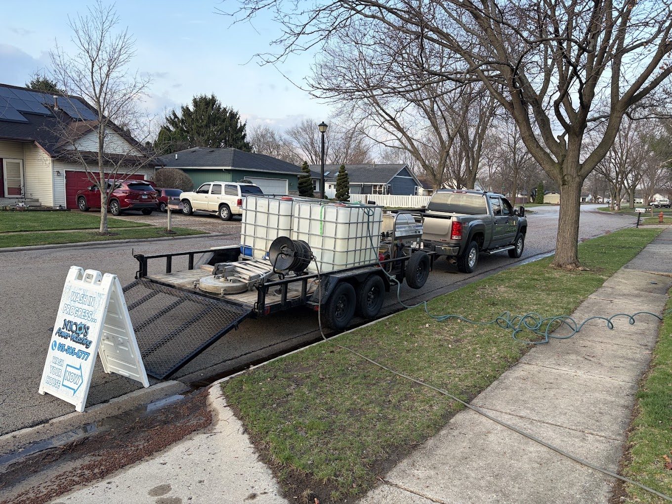Nico's truck and water trailer set up at a residential job site