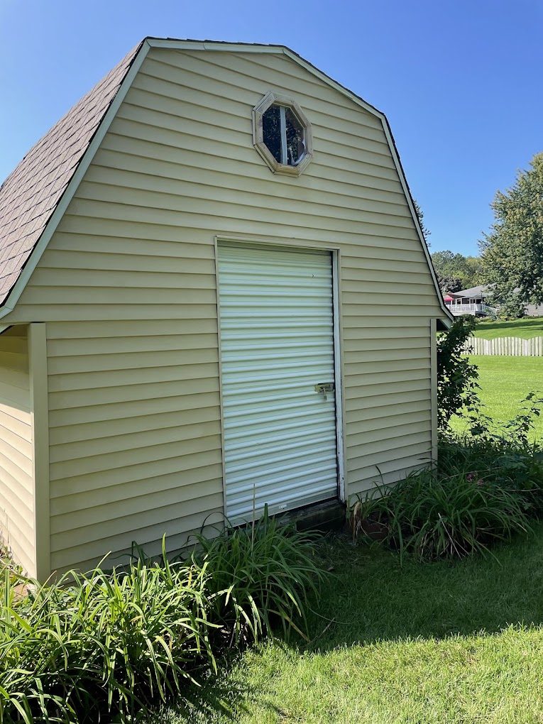 The same shed after a Nico's soft wash, bright and clean