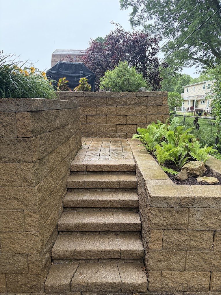 Retaining wall and stone steps restored to their original color